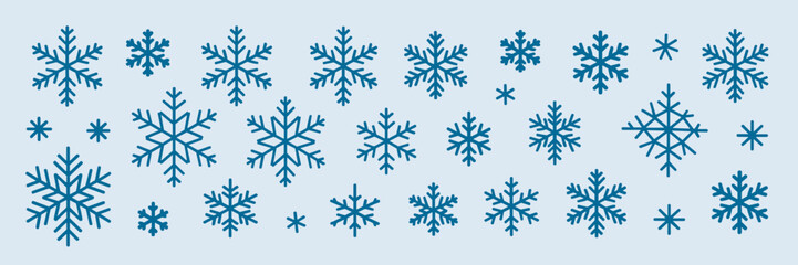 Sheet of winter snowflake icons in line and filled styles with varying sizes