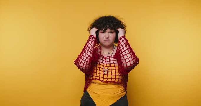 Feeling overwhelmed in a vibrant yellow setting during a candid moment of frustration and self-reflection