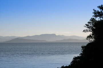 view of the white stone in Palhoça in the late afternoon, mountains in various shades of gray
