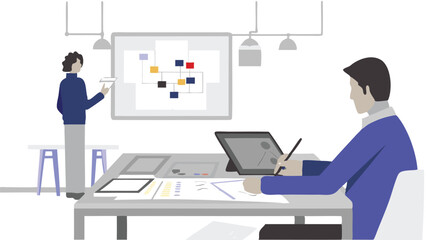 Two people in an office setting, one presenting a chart while the other works at a desk with a tablet