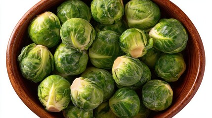 Top view of Brussels sprouts in a bowl isolated on white