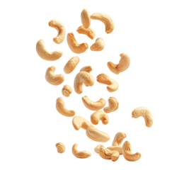A bunch of cashews are flying through the air