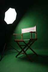 Chair of Film Director. Directors chair in green screen studio setup with softbox lighting. Ideal for filmmaking video production photo interviews and creative content with green chroma key background