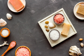 Essential oil and spa cosmetic products with sea shells, top view. Beauty spa therapy cosmetics and wellness background