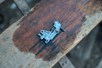 Used oil pump from chainsaw