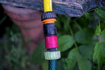 Garden irrigation hoses connected with a modern plastic hose connector