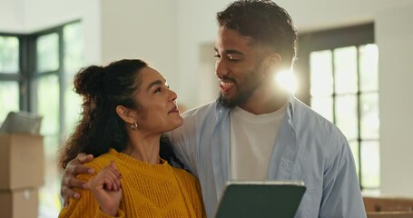 Happy couple, tablet and talk in new home with point for interior design, planning and hug at property. People, man and woman with real estate, app or online shopping for furniture choice at house
