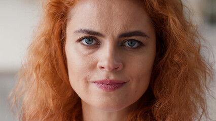 Close up female face serious angry irritated annoyed negative offended disappointed portrait ginger...
