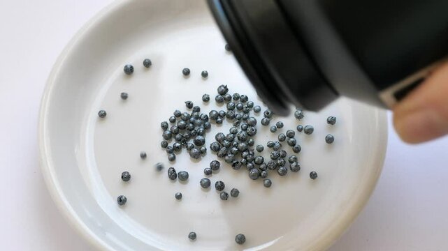 Dumping iodine crystals (granules) at the white dish