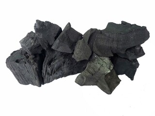 Natural wood charcoal is traditional charcoal made using hardwood isolated on a white background....