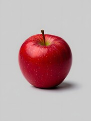 Stock photo of a fresh red delicious apple fruit on a grey background studio shot