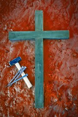 Laid Down Cross With Hammer & Nails  on Blood Red Mud