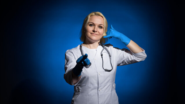 woman doctor offers us to call her showing it with the help of facial expressions