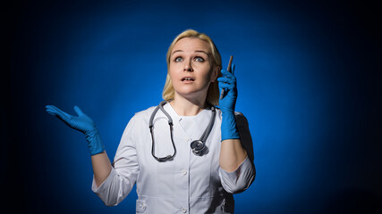 female doctor shrugging her hands while talking on the phone
