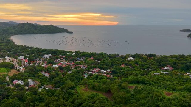Aerial footage of Playas del Coco, Costa Rica &mdash; golden beaches, lush hills, and a scenic bay filled with yachts, perfect for tourism, ocean adventures, and tropical getaways