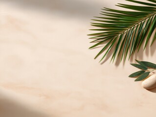 Green palm leaves and smooth pebbles arranged on a light sandy background, evoking a serene atmosphere perfect for relaxation during a heatwave or summer season