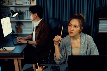 Serious face of thinking businesswoman focusing computer to report data analysis social media...