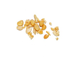 Fresh crushed peanuts isolated on white background. Roasted peanuts, fried peanuts. Whole groundnut pieces. Peanut fractions top view on white background.