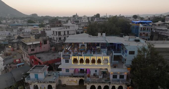 Aerial view of vibrant cityscape at dusk, India.