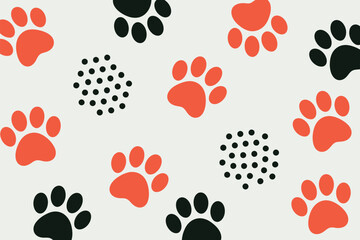 A pattern of black and orange paw prints and black polka dots on a white background creates a playful design