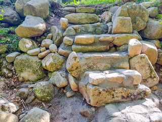 Stone stairs to a mountain river in a green forest. mountain resort Harrachov