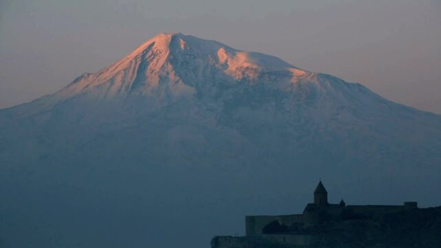 Mount ararat is covered in snow at sunset