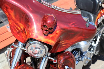 Close-up shot of a motorcycle with a skull emblem, suitable for use in scenes related to...