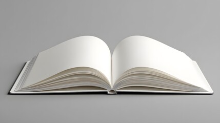 Elegant Display of a Pristine Open Notebook on a Cool Gray Background with Emphasized Simplicity and Creative Ambience