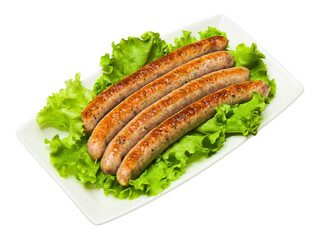 Cooked grilled sausages and green salad leaves