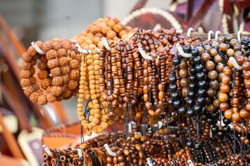 Various types and models of beaded bracelets are arranged on display.