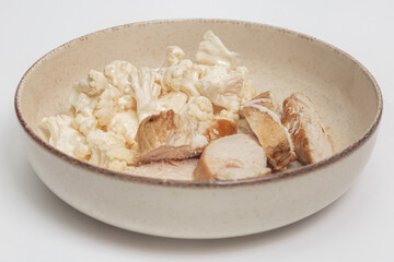 chicken breast with cauliflower in a plate