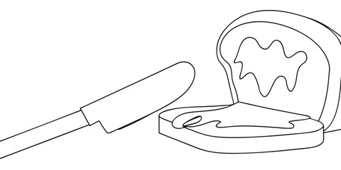 Bread slices with butter a knife on a spread