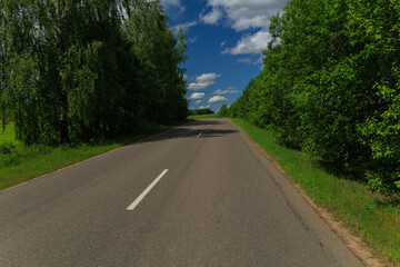 Highway wide road, transport and blue sky with clouds on a summer day