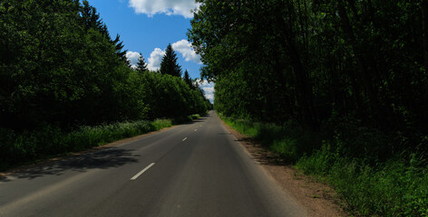 Fototapeta premium Highway wide road, transport and blue sky on a summer day