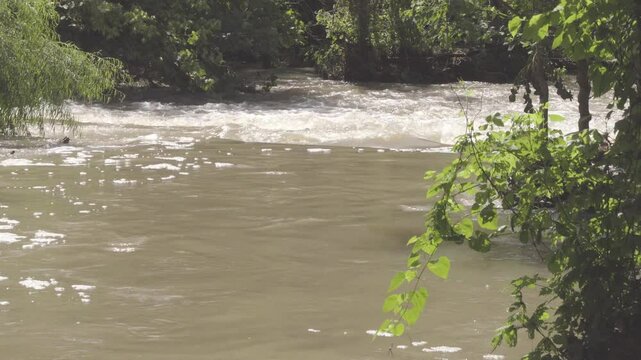 Texas 2025 flood water running across low-water road crossing