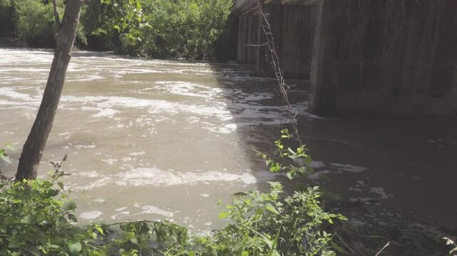 Texas 2025 flood water flowing under highway bridge