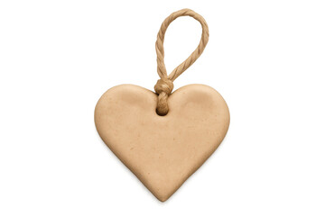 Natural twine suspending beige heart-shaped soap bar against transparent backdrop, highlighting personal care and wellness design elements