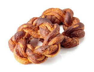 Homemade soft pretzels with cinnamon and sugar isolated on white background.