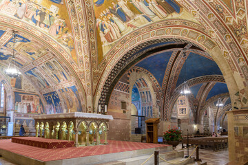 Interior view of the Lower Basilica of San Francesco in Assisi, showing the high altar, frescoed...