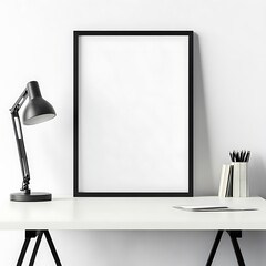 Minimalist desk setup featuring a blank black frame, offering a clean aesthetic and ideal for showcasing artwork or designs.