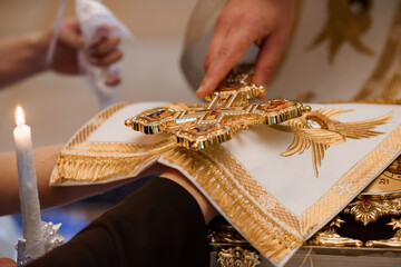 Orthodox Christian Wedding Ceremony: Blessing with Golden Cross Over Holy Book, Candles, and...