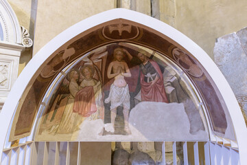 Frescoed lunette depicting the baptism of Christ with angel and John the Baptist in the Church of...