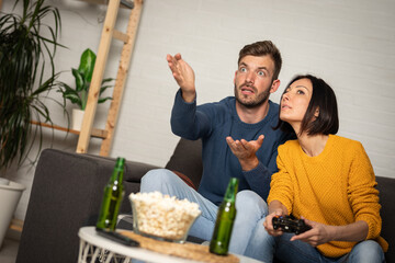 Couple enjoying game console at home