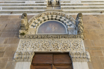 Romanesque portal of the Church of San Giusto, Lucca, Italy, with carved capitals, vegetal frieze,...