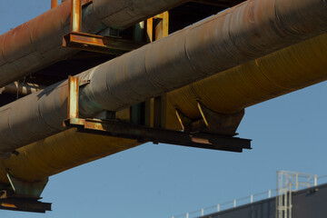 A large collection of pipes is suspended above the top of a building, creating an interesting...