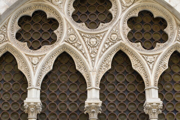 Gothic mullioned window with floral tracery and carved heads, Church of Santa Maria della Rosa,...