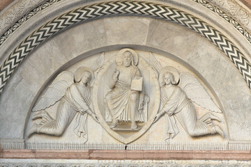 Detail of Christ in Majesty with angels in the central tympanum above the main portal of San...