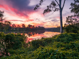 Beautiful Sunset Over The River with Cloud Reflections
