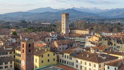 View from Guinigi Tower showing Basilica di San Frediano and bell tower in Lucca, Italy, with...