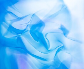 Obraz premium Abstract light blue flowing smooth fabric